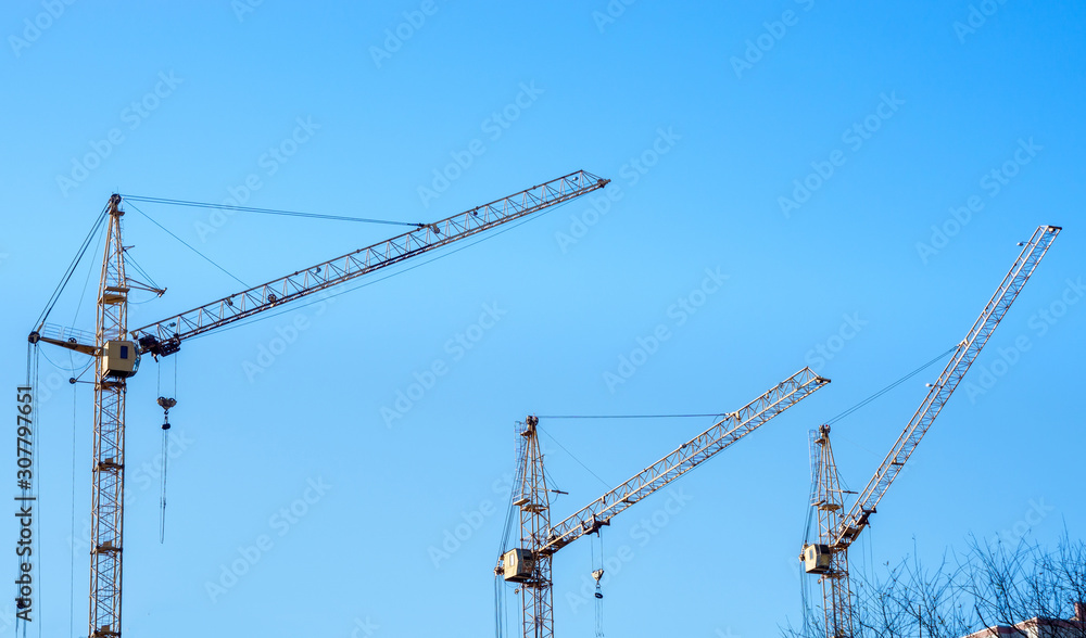 tower Construction site with cranes and building with blue sky background. Construction of the new building.
