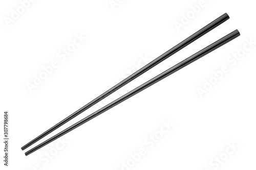 Metal black chopsticks isolated on white background photo