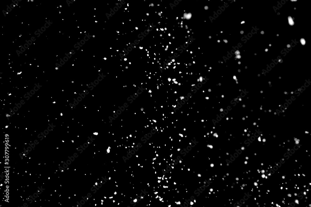 White snow falling down on black background White snow falling down on black background