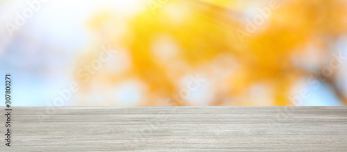 Empty wooden surface against blurred background. Bokeh effect