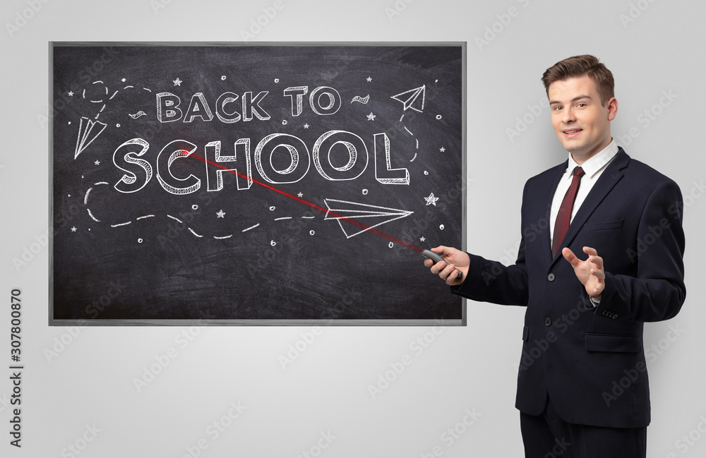 Handsome young teacher with laser pointer teaching Handsome young teacher with laser pointer teaching