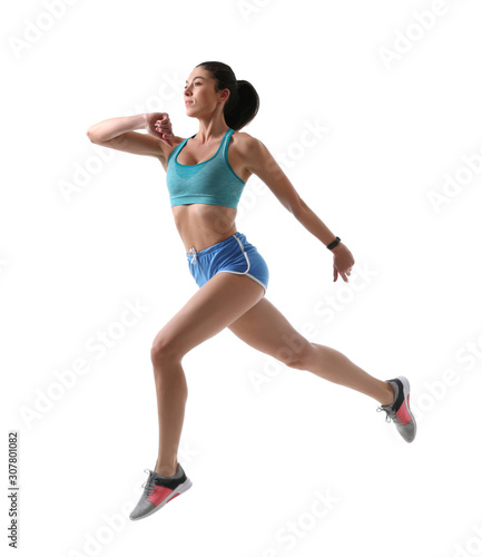 Athletic young woman running on white background, side view © New Africa