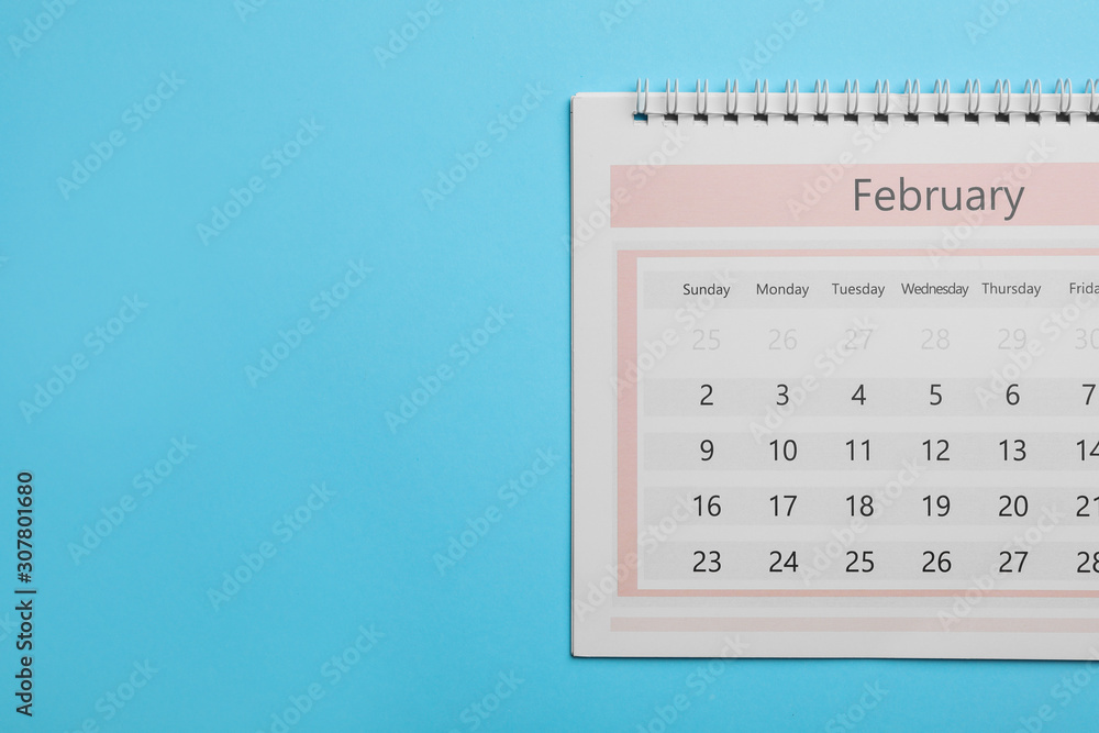 February calendar on light blue background, top view. Space for text February calendar on light blue background, top view. Space for text