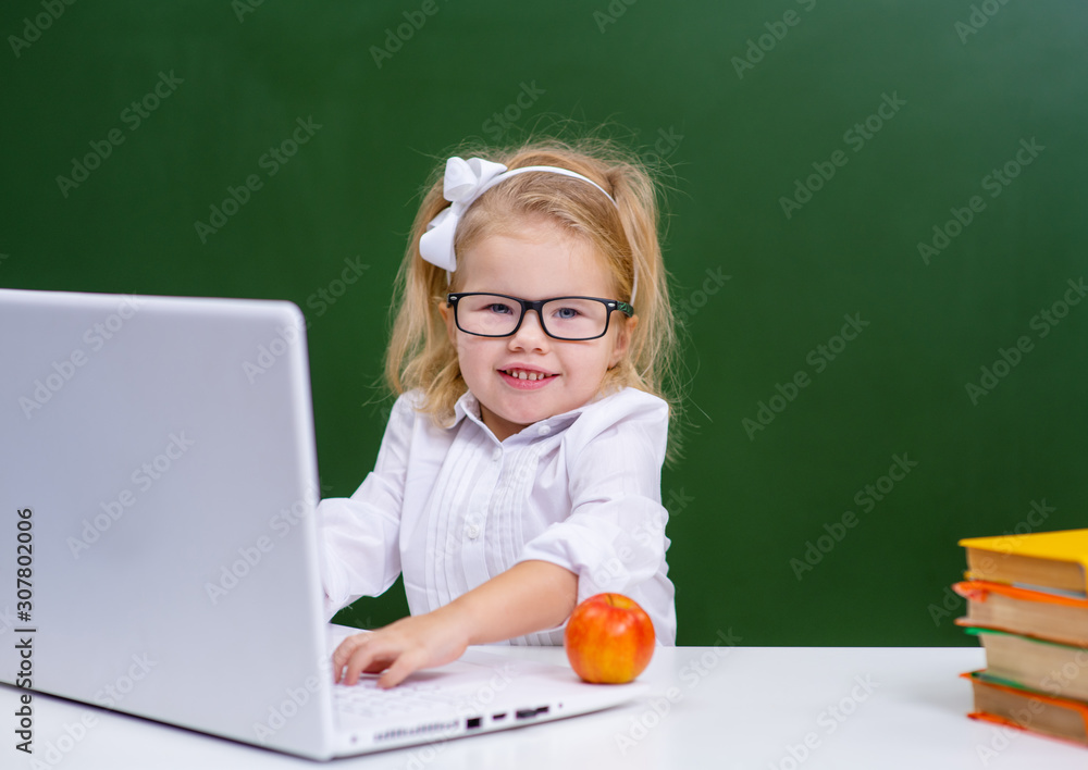 the child learns sitting at a computer at school the child learns sitting at a computer at school