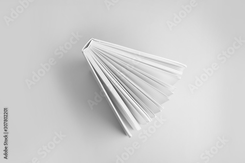 Hardcover book on grey background  top view