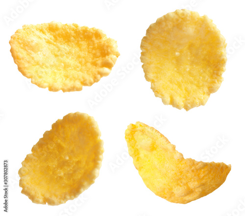 Set of tasty crispy corn flakes on white background
