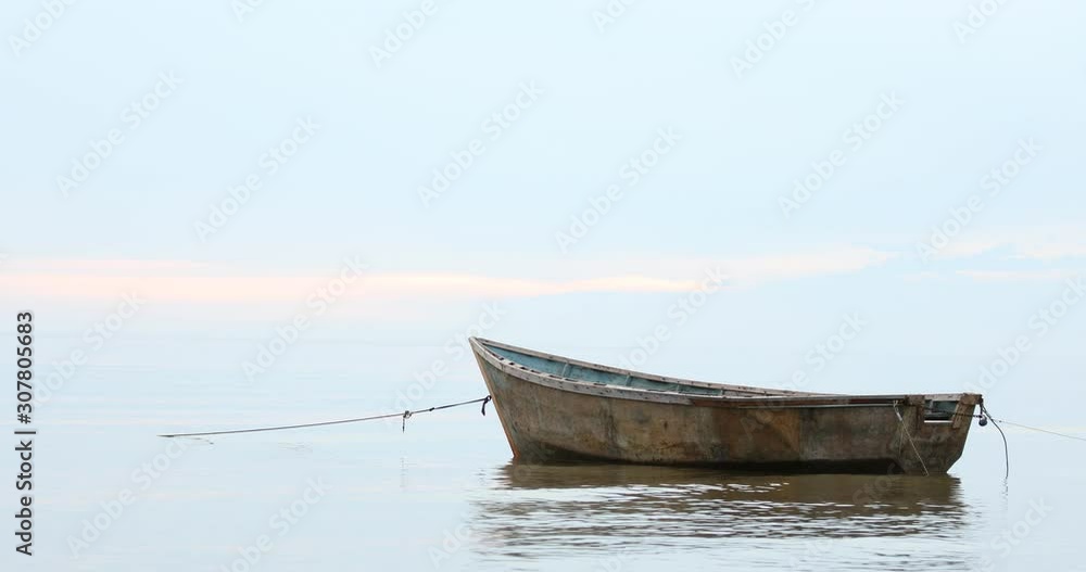 Idyllic scene of the gentle blue sky over the calm sea with the boat in the foreground, Baltic sea. The concept of harmony and serenity Idyllic scene of the gentle blue sky over the calm sea with the boat in the foreground, Baltic sea. The concept of harmony and serenity