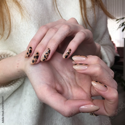 French manicure on women's thick handles with leopard design.