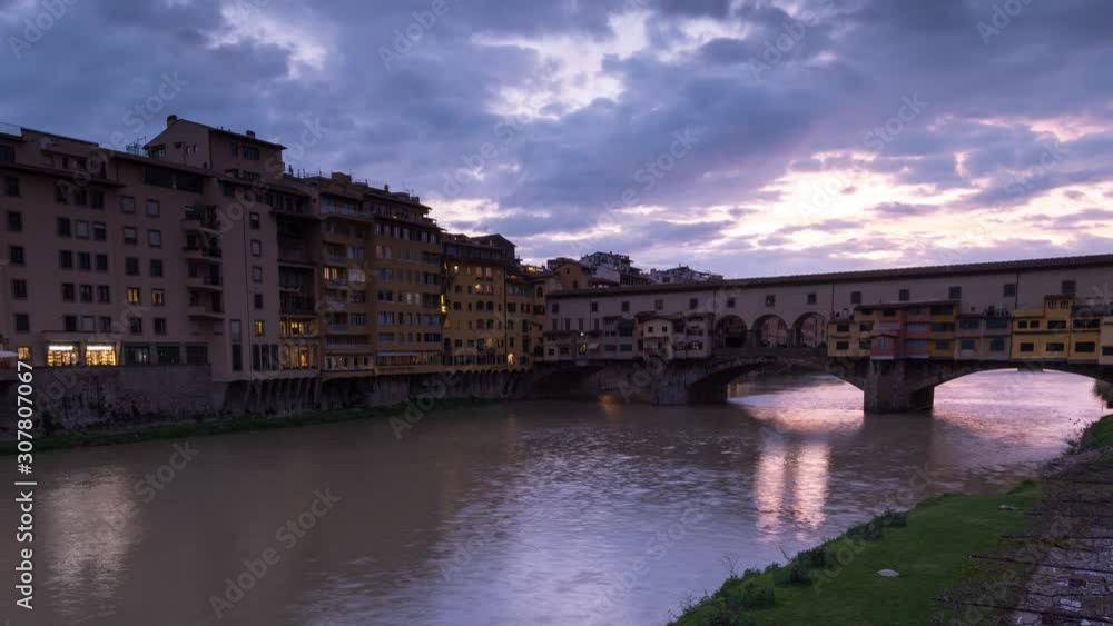 Sunset view of famous Ponte Vecchio over Arno River in Florence, Italy, timelapse day to night. Close up. Sunset view of famous Ponte Vecchio over Arno River in Florence, Italy, timelapse day to night. Close up.