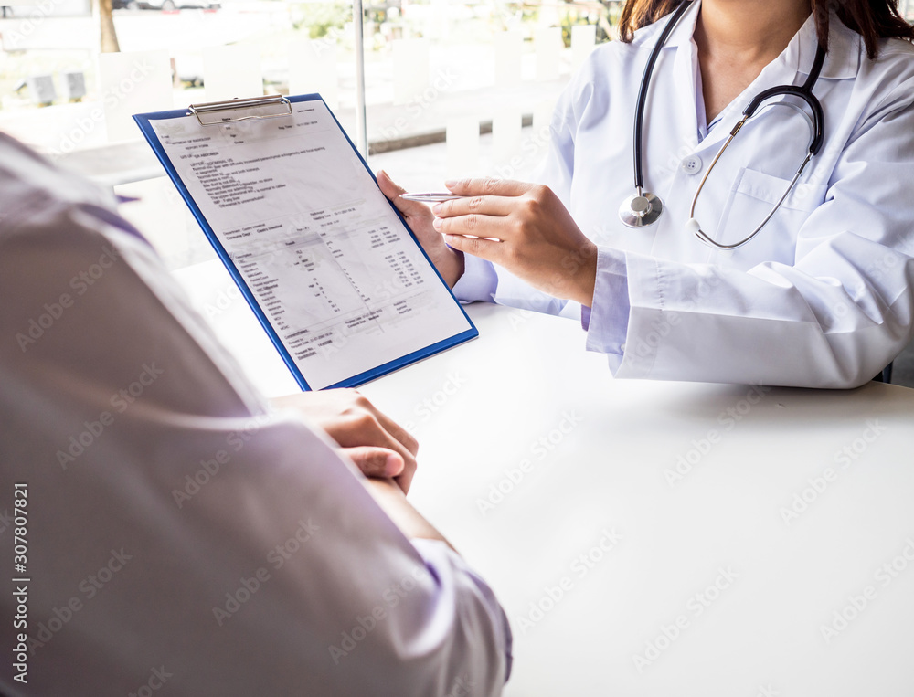The doctor explained the health examination results to the patient, medical checkup concept