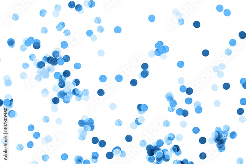 Bright blue confetti isolated on a white background. Festive concept. Children's party, birthday, wedding, celebration. Top view. Copy space.