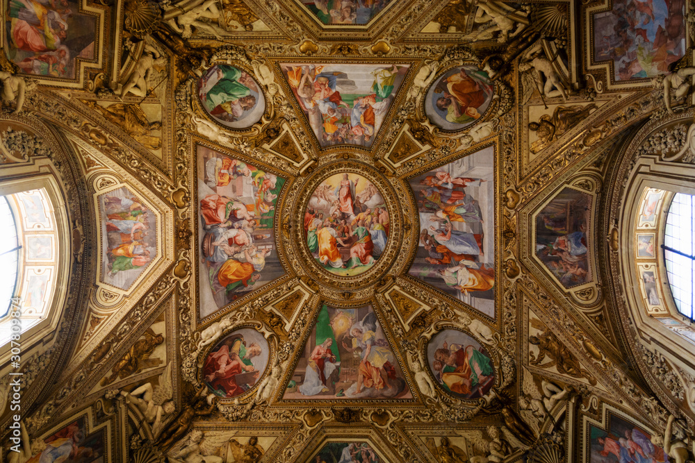 Painted ceiling icons in renaissance style in the Basilica of Santa Maria in Trastevere, Rome, Italy