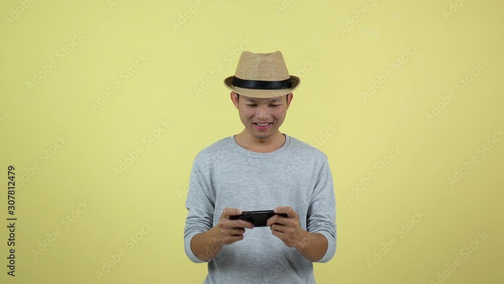 Asian Thai play gaming on smart phone. Asian Thai play gaming on smart phone.