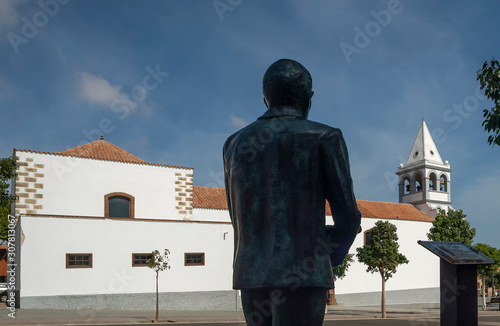 The Parish of Our Lady of the Rosary in Puerto del Rosario, Fuerteventura, Spain and the Unamuno statue photo