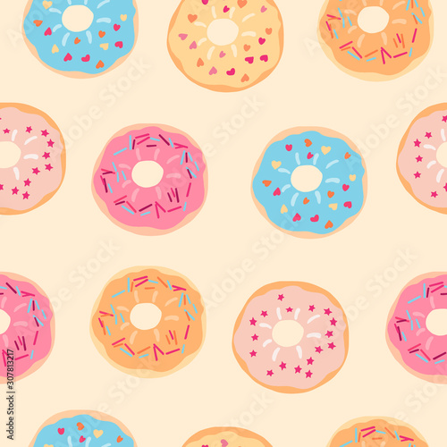 Vector seamless pattern with testy colorful donuts on light yellow background. Print for fabric, wrapping papers, wallpapers, covers, scrapbooking. Food illustration, great for bakery package design.