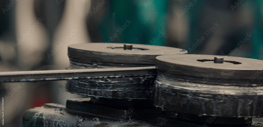 Fototapeta premium Metal profile forming machine. Sheet metal processing.