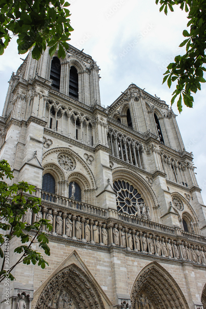 Front facade of the Notre Dame Cathedral in natural colors, Paris, France