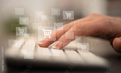 Business woman hand typing on keyboard with online shopping concept