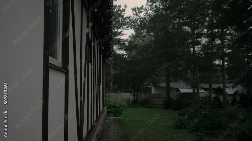 Rain drip along the walls of the house in Scandinavian style Rain drip along the walls of the house in Scandinavian style