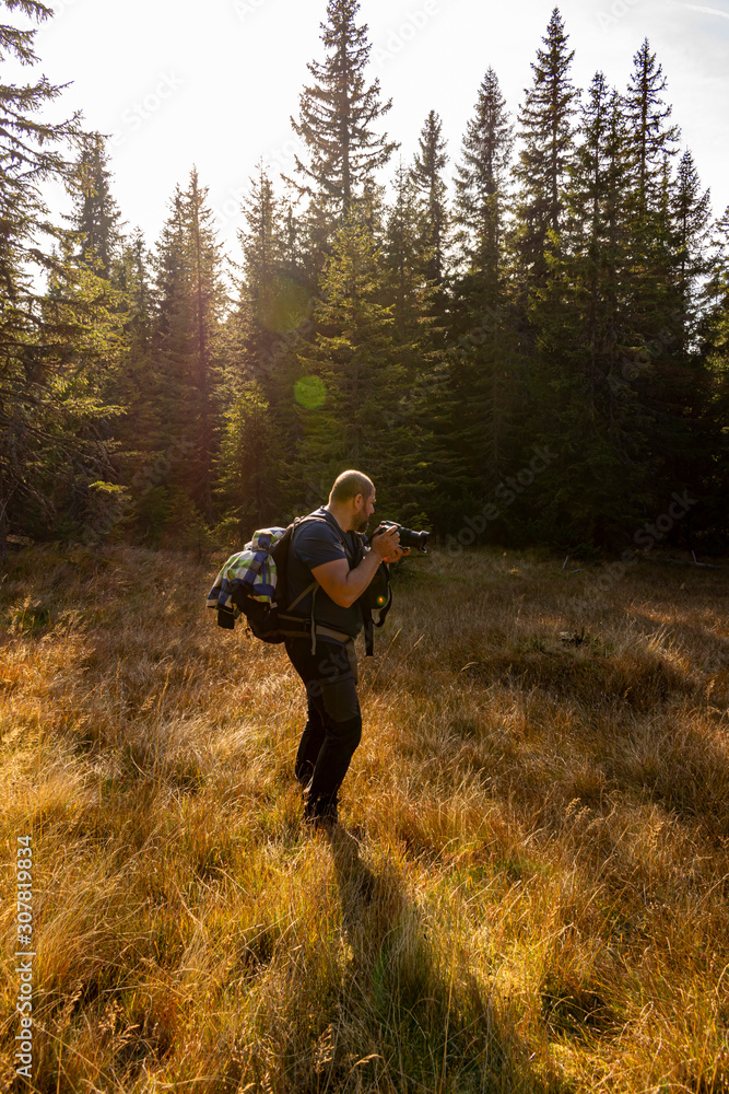 man tourist photographer on a mountain. man tourist photographer on a mountain.