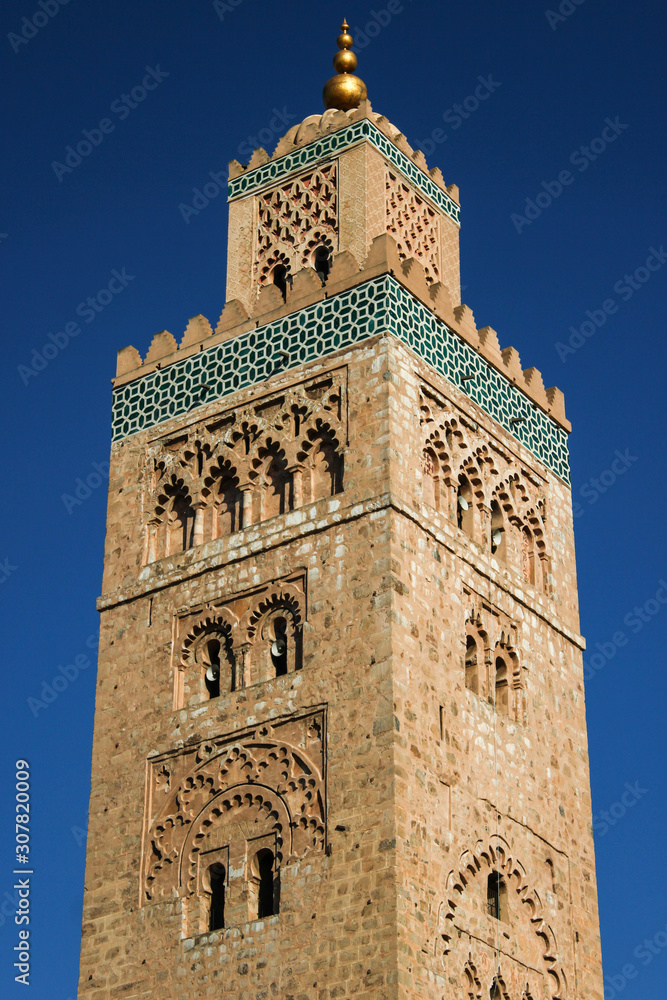 The Koutoubia Mosque or Kutubiyya Mosque is the largest mosque in Marrakesh, Morocco. Detailed photo of the tower.