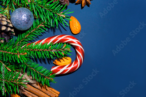 Christmas background. Upper, above, top view, of pine and spruce, evergreen, paper presents and Christmas red toys, with free space for text writing.