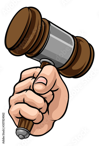 A hand in a fist holding a judge hammer gavel