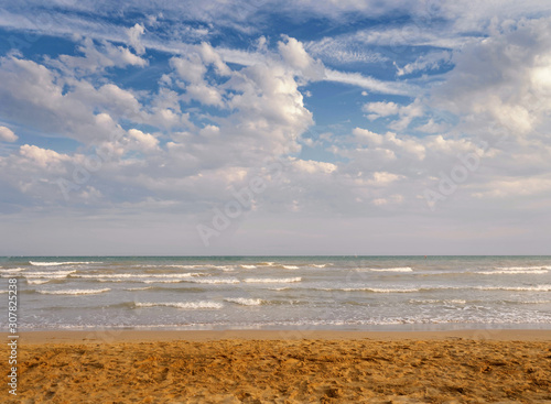 sea ocean on a background of blue sky with clouds