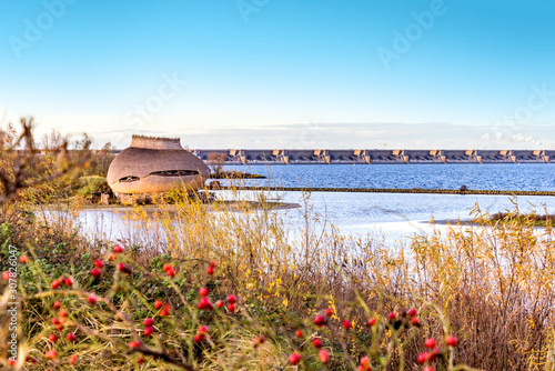 Bird Observatory Tij, completely ecologically built full view with part of the Delta Works in the background, Haringvliet photo