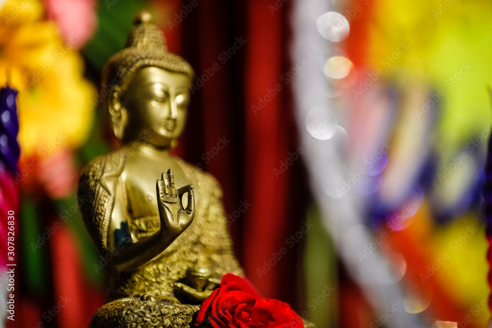 Fototapeta premium Lord Buddha sculpture with candle 