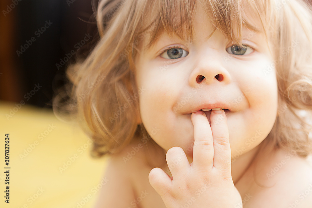 Portrait of a smiling funny little boy, happy curly toddler Portrait of a smiling funny little boy, happy curly toddler