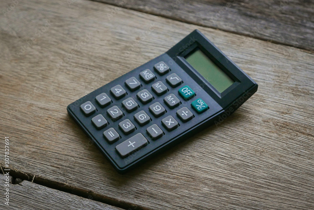 Calculator on wooden background. Calculator on wooden background.