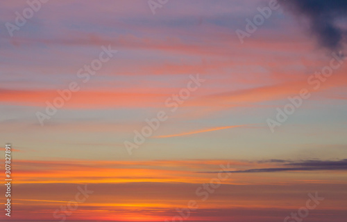 Amazing colorful cloudy landscape at sunset, like watercolor background. © IrinaK