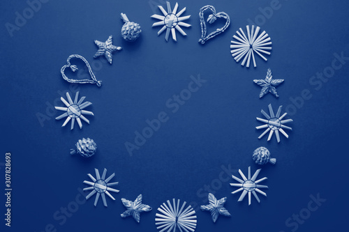 Wallpaper Mural Christmas natural wood decorations frame toned in color of the year 2020 classic blue, top view, copyspace. Flat lay, christmas card with ornaments from ecological materials, top view Torontodigital.ca