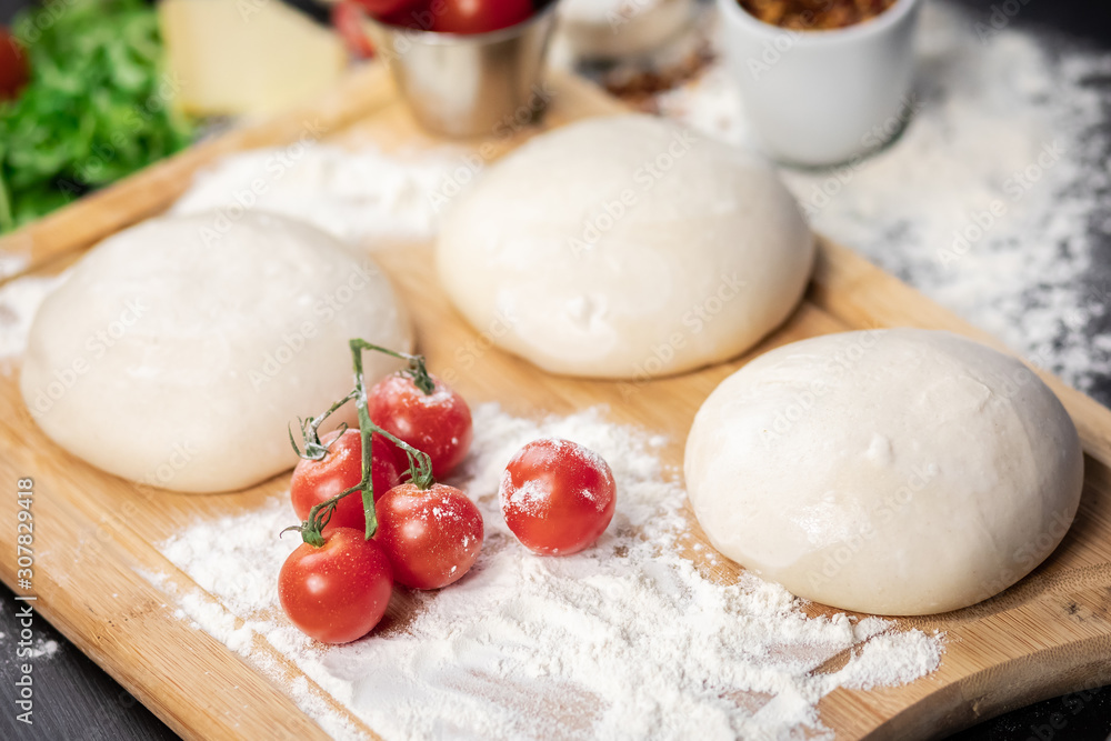 Pizza dough and raw ingredients. Pizza dough and raw ingredients.