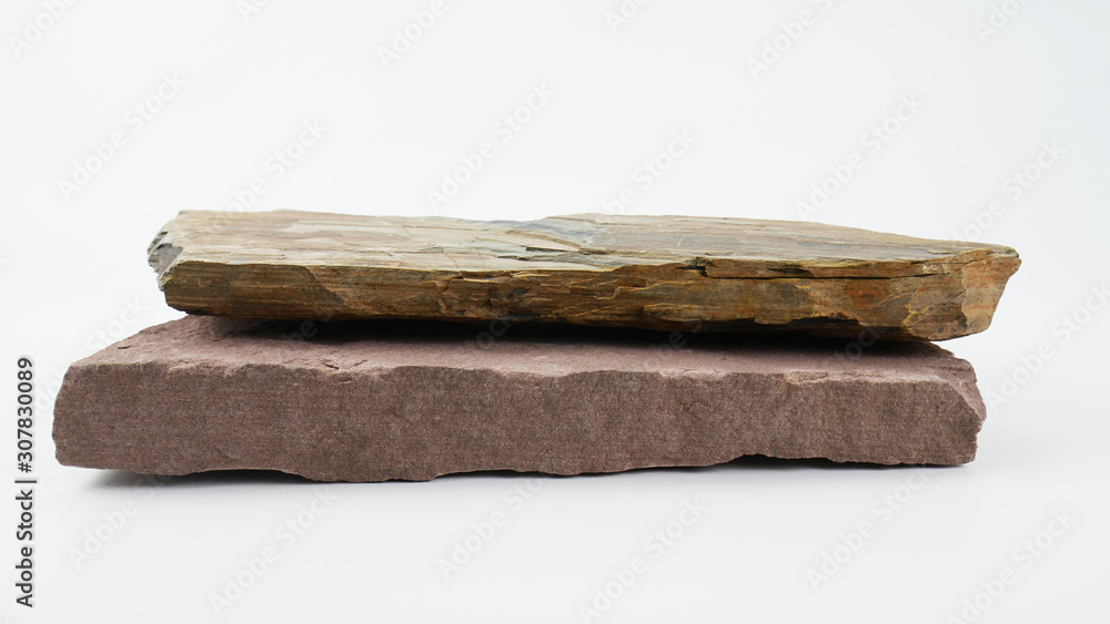 Fototapeta premium Stone overlap front blurred board empty table on White background, for product display, Blank for mockup design.