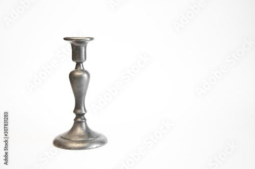 Antique iron or copper candlestick. On white background. Christmas