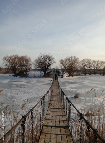 bridge over the river in winter © Андрей Стельченко