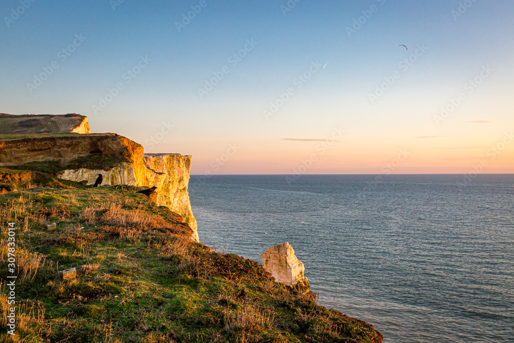 Looking out over the ocean at sunset, from the cliffs at Seaford, in Sussex