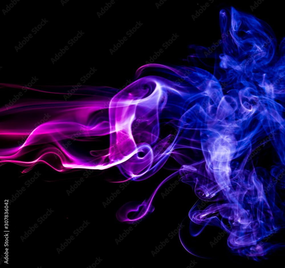 Fototapeta premium Colored smoke on black background