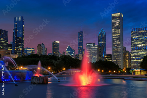 Chicago City at night with skyscrapers and Buckingham fountain, Chicago, Illinois, USA.