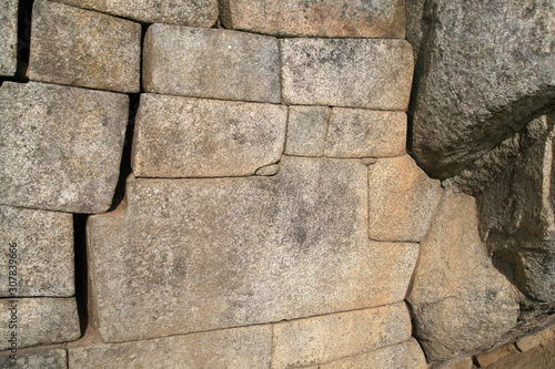 The famous 12-angled stone in ancient Inca architecture, Machu Picchu, Peru photo