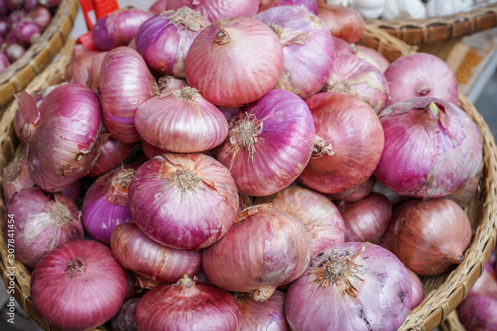 Full seed of red shallots in bracket close up. Full seed of red shallots in bracket close up.