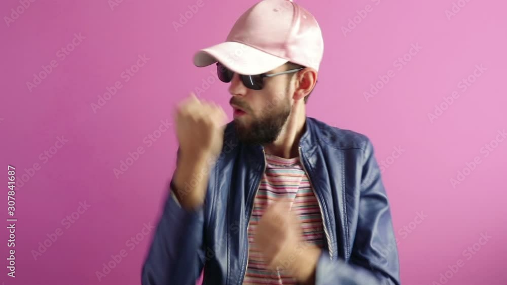handsome stylish bearded man dancing having fun on pink background handsome stylish bearded man dancing having fun on pink background