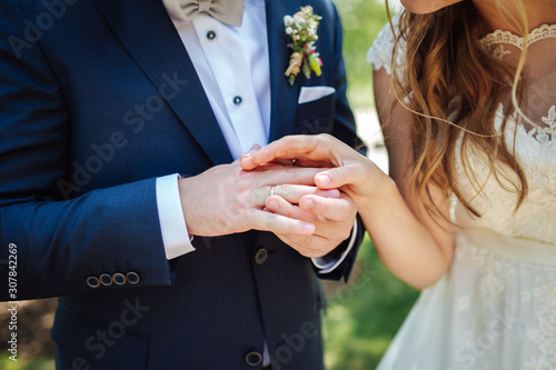 bride and groom holding hands