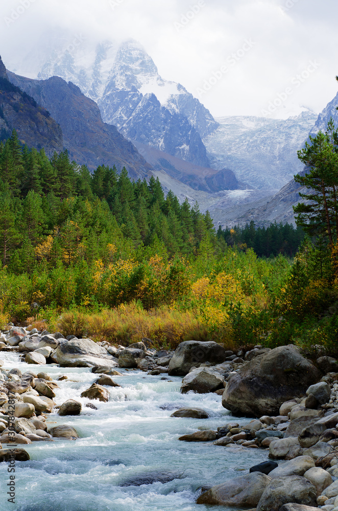 green valley in the mountains in early autumn green valley in the mountains in early autumn