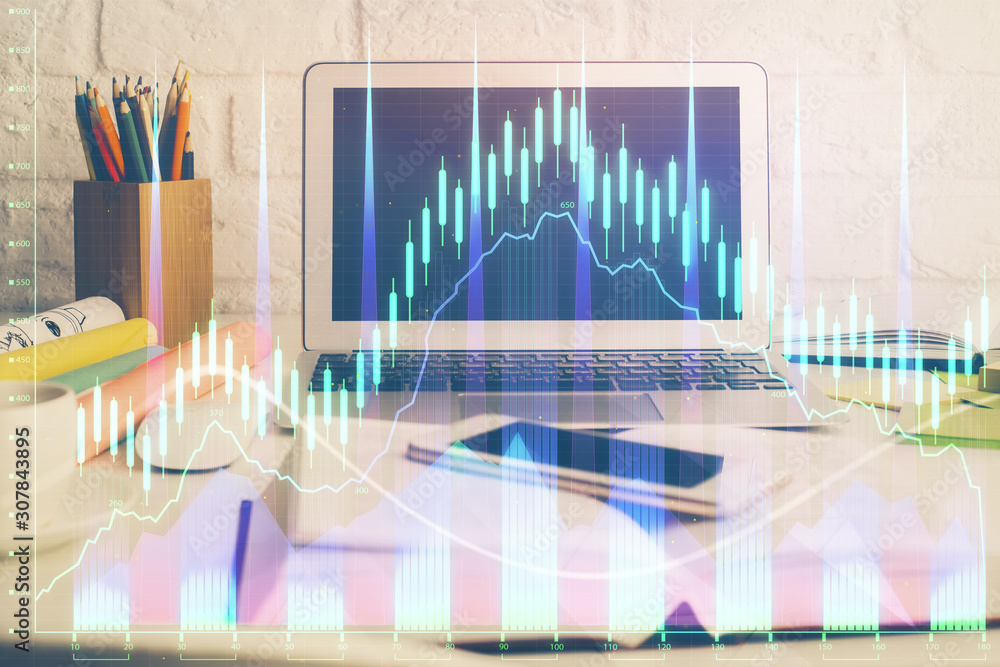 Forex market chart hologram and personal computer background. Double exposure. Concept of investment. Forex market chart hologram and personal computer background. Double exposure. Concept of investment.