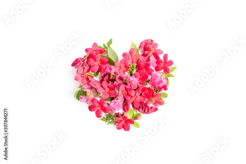 heart shaped filled flower arrangement using red pink flowers green leaves