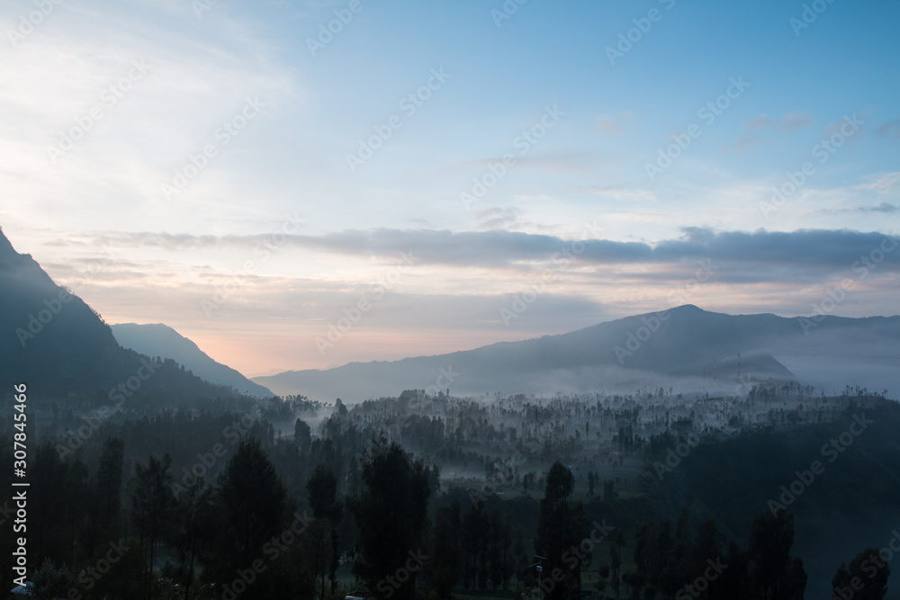 Fototapeta premium Volcano Bromo at sunset time background near Cemoro lawang village at mount Bromo in Bromo tengger semeru national park, East Java, Indonesia.
