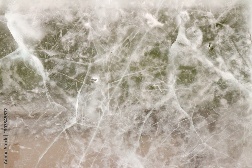 Translucent ice plate with cracks, ice winter background Translucent ice plate with cracks, ice winter background